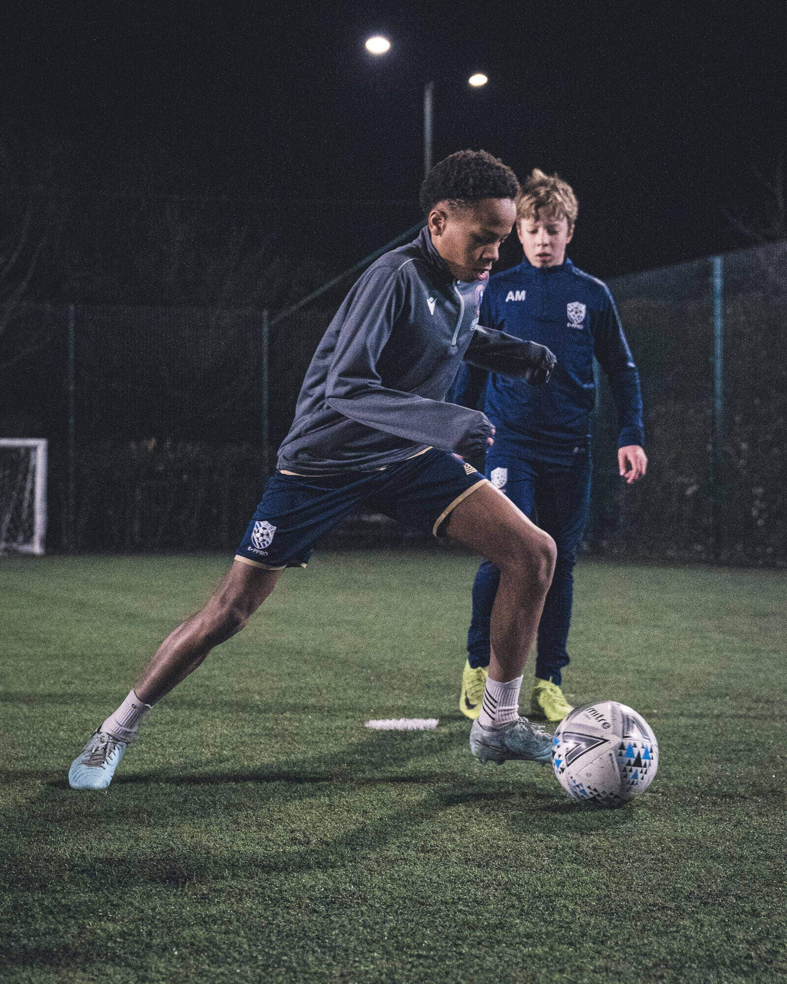 E-PPRO player working on the ball in a night session